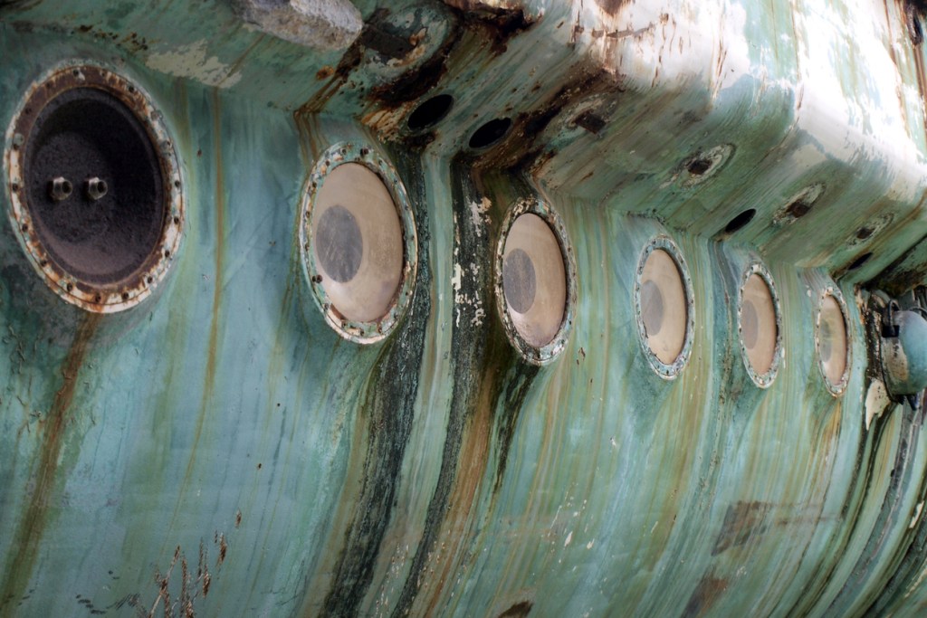 rusty portholes of a submarine